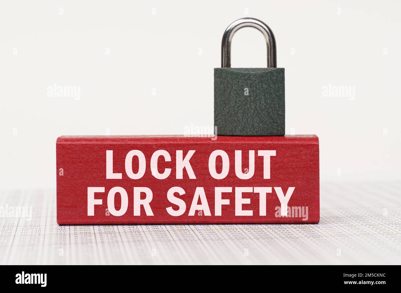 Business and security concept. On the reports there is a red block with ...