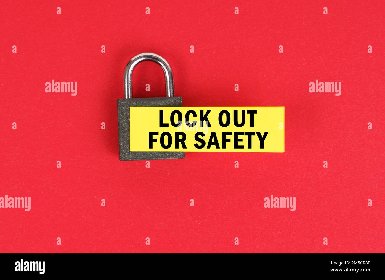 Business and security concept. On the red surface there is a lock with