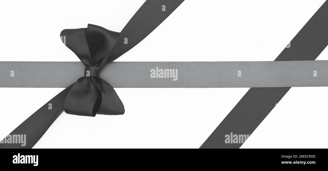 Satin ribbon bow for gift box in black color, isolated on white ...