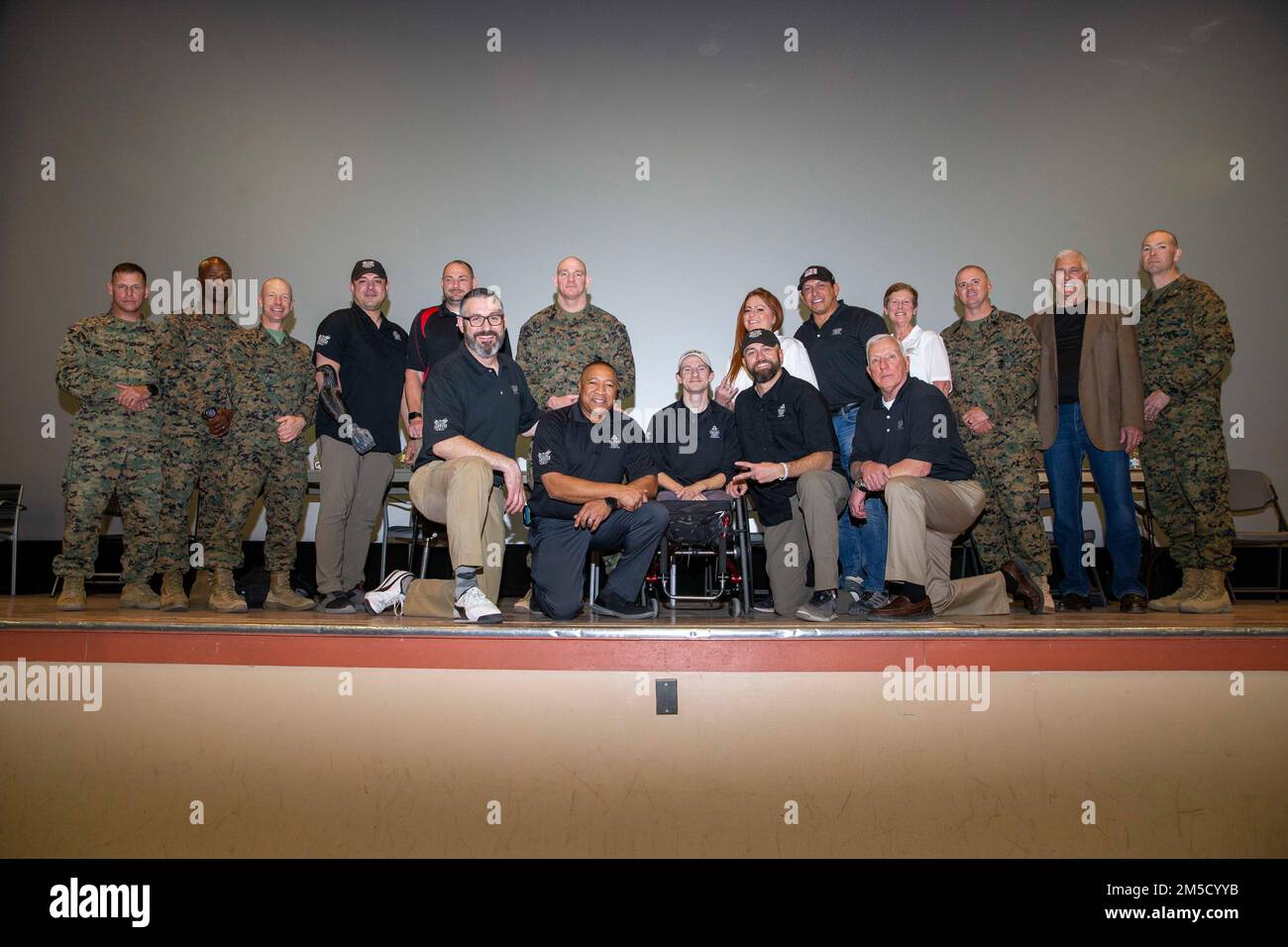 U.S. Marine Corps Sgt. Maj. Troy E. Black, the 19th Sergeant Major of the Marine Corps, poses for a group photo with veterans at a Troops First town hall at Marine Air Ground Combat Center, Twentynine Palms, California, March 2, 2022. The Sergeant Major of the Marine Corps spoke to Marines about talent management, force design, human performance and the importance of staying connected. The Troops First Foundation was created to develop, operate and support wellness, quality of life and event-based initiatives for post-9/11 combat-injured warriors. Stock Photo