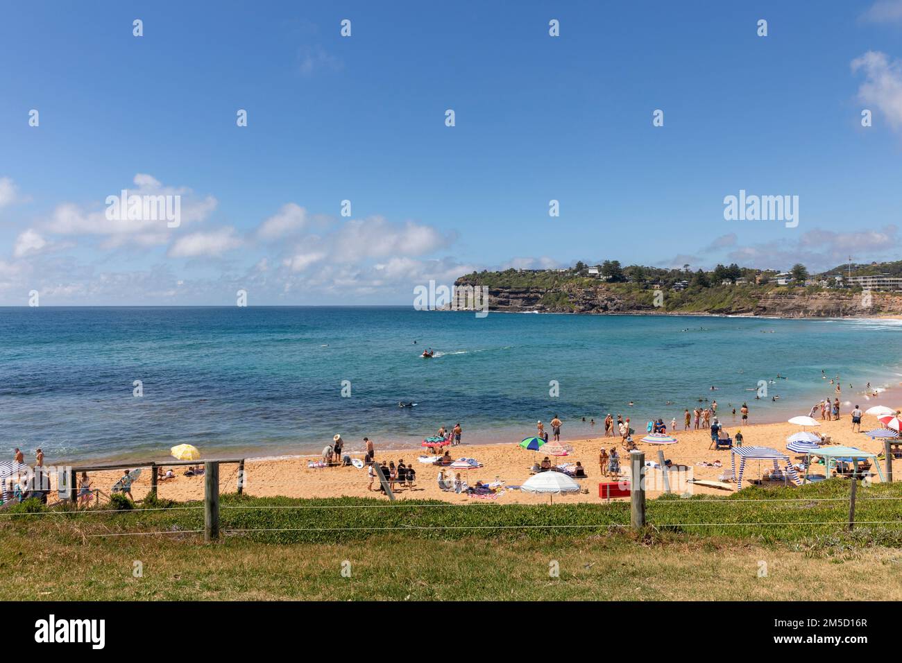 Relaxing and sunbathing summers day at Avalon Beach in Sydney,NSW,Australia with blue sky copy space Stock Photo