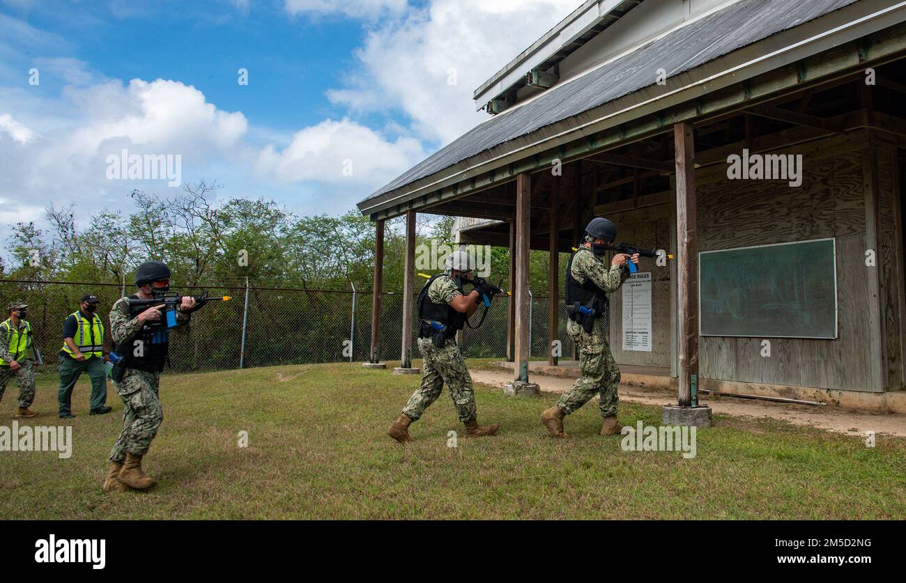 SANTA RITA, Guam (March 3, 2022) - Sailors from U.S. Naval Base Guam’s Navy Security Forces respond during an active shooter exercise, as part of the Command Assessment of Readiness and Training (CART) at NBG March 2.     CART is a Commander, Navy Installations Command program that evaluates installations on their response capabilities and ability to train their personnel in various scenarios.     The exercise involves training scenarios that replicate real-world events. It is designed to enhance the training and readiness of Navy security forces response to threats to installations and units. Stock Photo