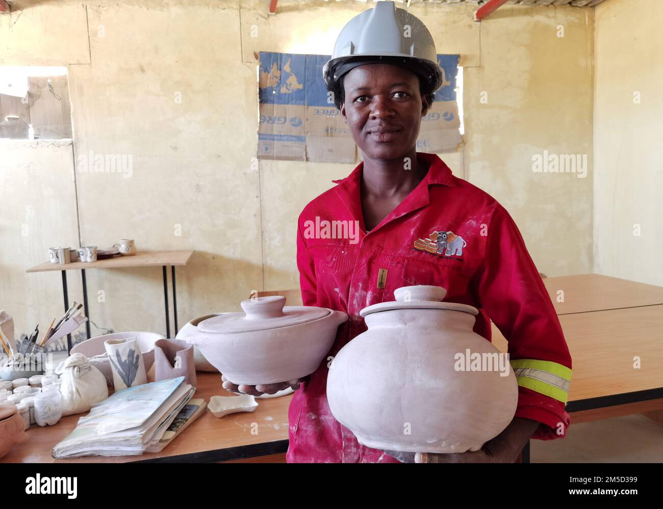 Ondangwa. 20th Dec, 2022. Jacobina Nangula displays her products at a workshop in Iindjinda village in the Oshana region of Namibia on Dec. 20, 2022. TO GO WITH 'Feature: Namibian entrepreneur reaps gain from modernized traditional pottery-making art' Credit: Ndalimpinga Iita/Xinhua/Alamy Live News Stock Photo