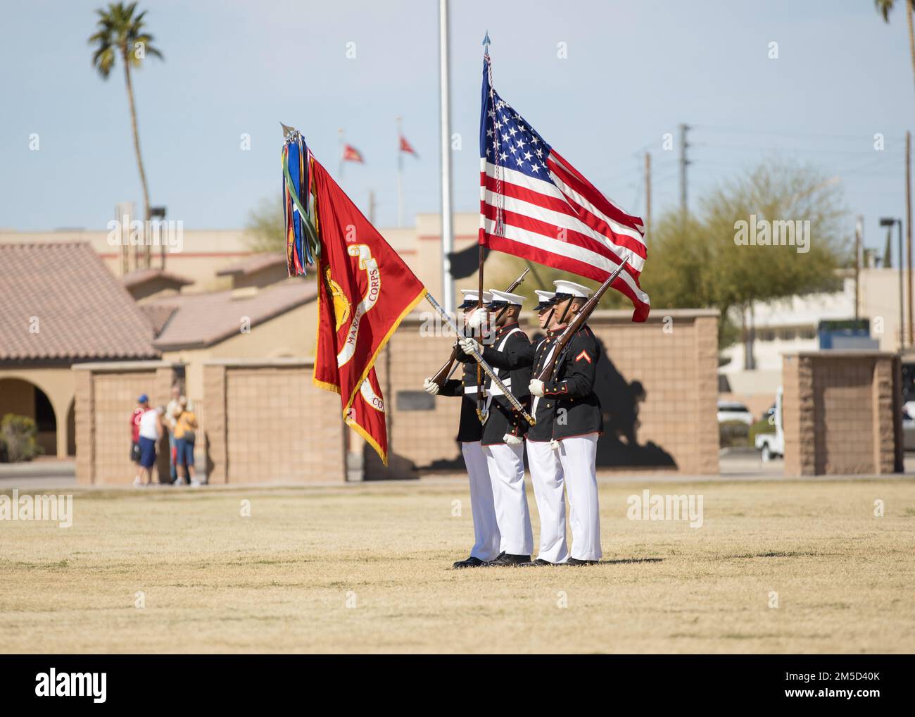 Marines with the Official U.S. Marine Corps Color Guard present the National Ensign at Marine Corps Air Station Yuma, Arizona, Mar. 3, 2022. The Battle Color Detachment annually visits Yuma for its ideal weather during this season to begin training for their upcoming performances. For the past month the Marines have been training to perfect their drill and continue the tradition of ceremonial excellence. Stock Photo