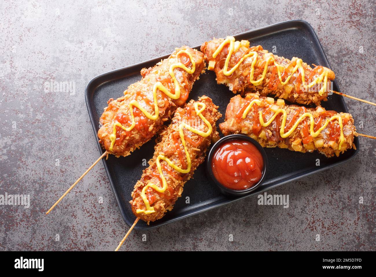 Korean corn dogs are hot dogs, cheese, French fries fried in a batter