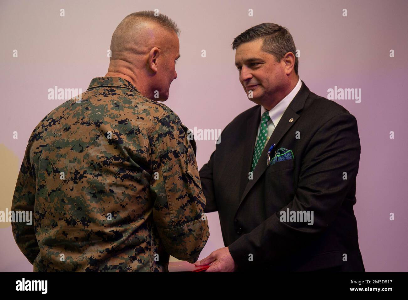 Mr. Shon P. Brodie, director of Maritime Expeditionary Warfare Division, Capabilities Development Directorate, is presented the Superior Civilian Service Award during a ceremony at the Davis Center on Marine Corps Base Quantico, March 3, 2022. He was hand chosen for his distinguished professionalism, initiative, and total dedication to duty by Maj. Gen. Eric E. Austin, director of Capabilities Development Directorate, CD&I. Stock Photo