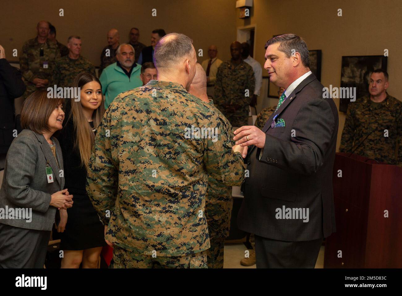 Mr. Shon P. Brodie, director of Maritime Expeditionary Warfare Division, Capabilities Development Directorate, is presented the Superior Civilian Service Award during a ceremony at the Davis Center on Marine Corps Base Quantico, March 3, 2022. He was hand chosen for his distinguished professionalism, initiative, and total dedication to duty by Maj. Gen. Eric E. Austin, director of Capabilities Development Directorate, CD&I. Stock Photo