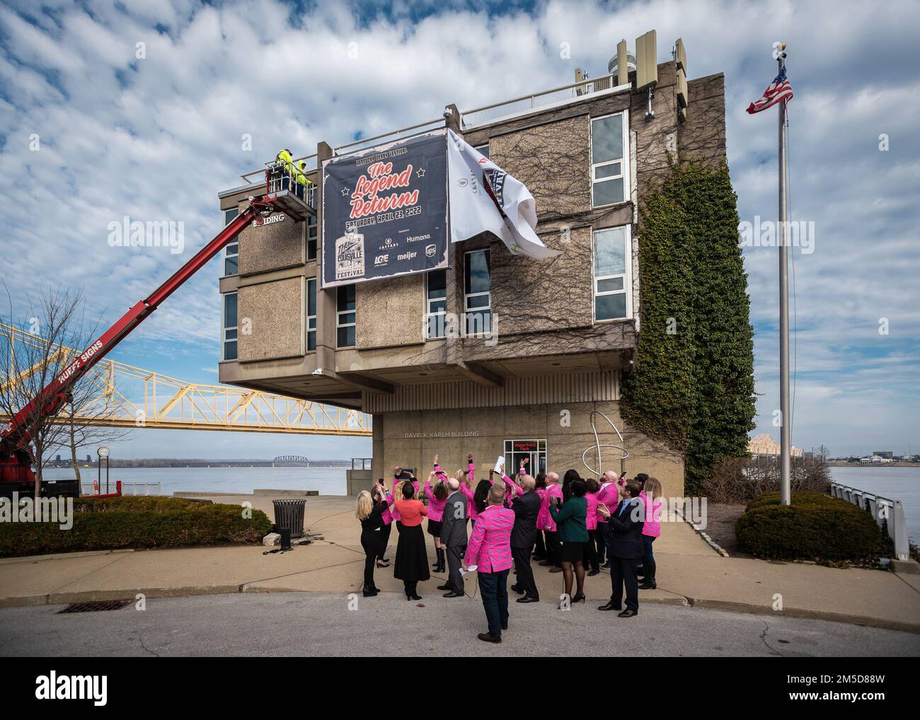 Members of the Kentucky Derby Festival unveil a banner promoting the 2022 Thunder Over Louisville air show and fireworks display during a press conference held along the Ohio River in downtown Louisville, Ky., March 3, 2022. Thunder will return to the waterfront April 23 after a two-year absence and is expected to feature dozens of aircraft, including the U.S. Air Force F-22 Raptor Demo Team and a brand-new C-130J Super Hercules from the Kentucky Air National Guard. This year’s event celebrates the 75th anniversary of the United States Air Force. Stock Photo