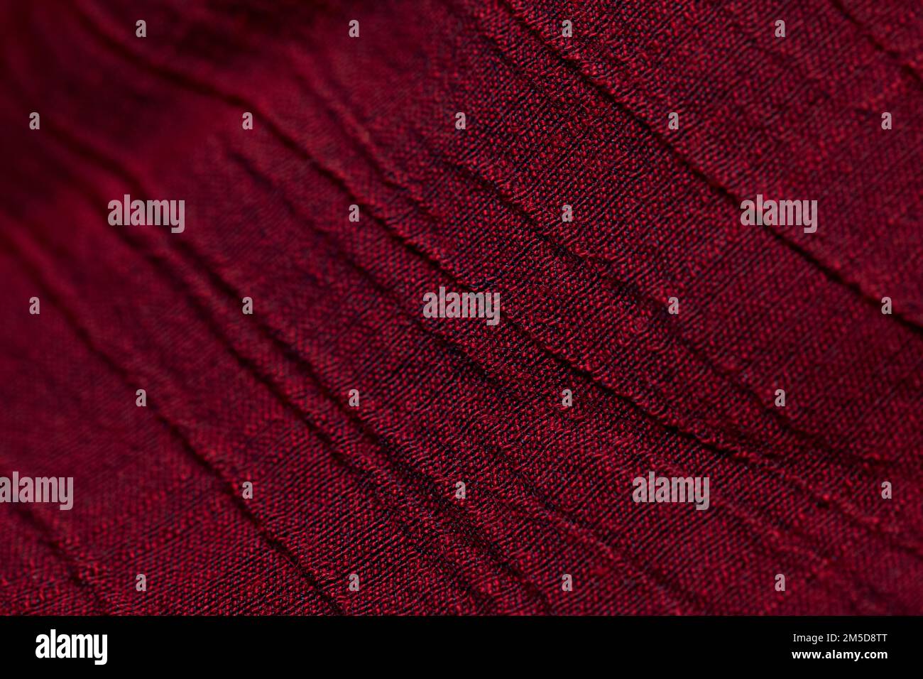 Red fabric background texture pattern. Red fabric cloth textile material. Stock Photo