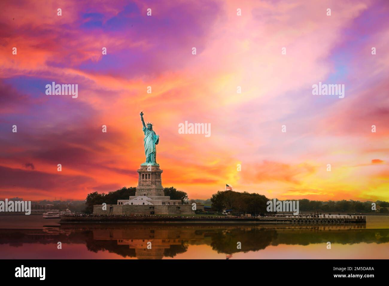 the liberty statue in new york with great sunset Stock Photo
