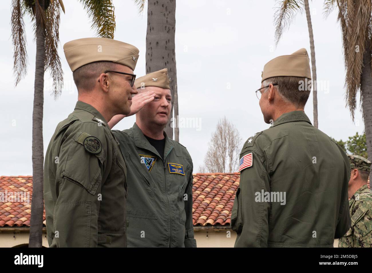 SAN DIEGO (Mar. 3, 2022) - Capt. Quentin Packard (left) stands relieved as commodore of Maritime Support Wing (MSW) as his relief, Capt. Edward Hoak (middle), reports to Rear Adm. Scott Jones, Commander, Naval Air Force Reserve (right) to assume command as MSW commodore during a change of command ceremony in the courtyard of the World Famous I-Bar at Naval Base Coronado, Mar. 3. MSW is a Navy Reserve air wing comprised of rotary and patrol units providing dedicated special operations forces (SOF) support, strategic depth in helicopter maritime strike and airborne mine countermeasures, and endu Stock Photo