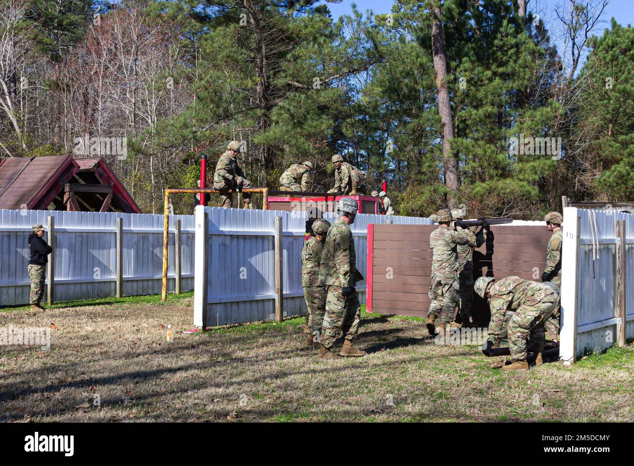 U.S. Army Soldiers attending the U.S. Army Aviation Center of Excellence Noncommissioned Officer Academy - Eustis Advanced Leaders Course navigate the Leaders Reaction Course March 4, 2022 here at Fort Eustis, Virginia. The LRC is a team building obstacle course designed to train skills in leadership, operational planning, time management and self-devlopment. Stock Photo