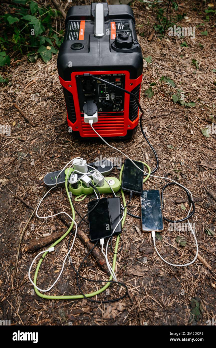 Portable charging power station with mobile phones in nature, portable
