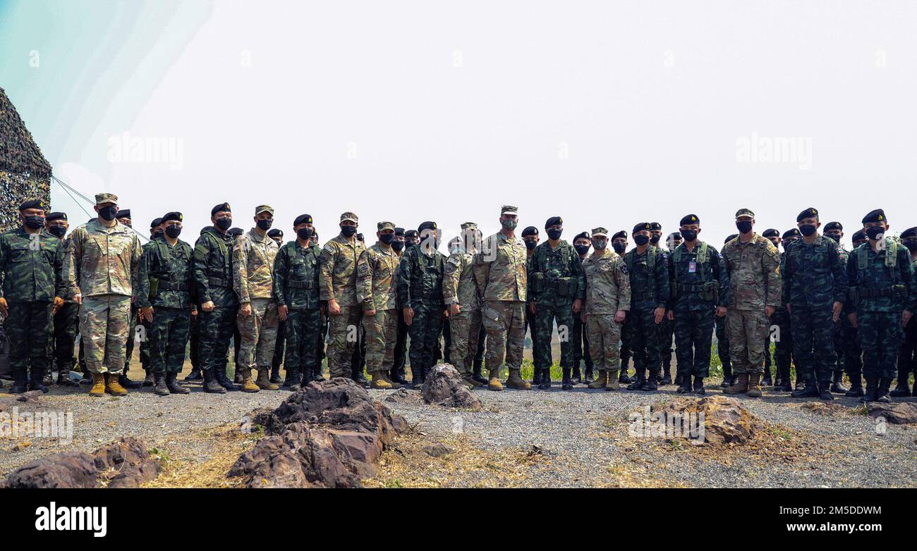 Unit commander teams with the 2nd Stryker Brigade Combat Team, 2nd Infantry Division, and the 112th Infantry Regiment, Royal Thai Army, pose with Royal Thai Army soldiers after conducting a combined arms live fire exercise as part of Cobra Gold 2022 in the Lopburi Province of the Kingdom of Thailand, Mar 4, 2022. CG 22 is the 41st iteration of the international training exercise that supports readiness and emphasizes coordination on civic action, humanitarian assistance, and disaster relief. From Feb. 22 through March 4, 2022, this annual event taking place at various locations throughout the Stock Photo