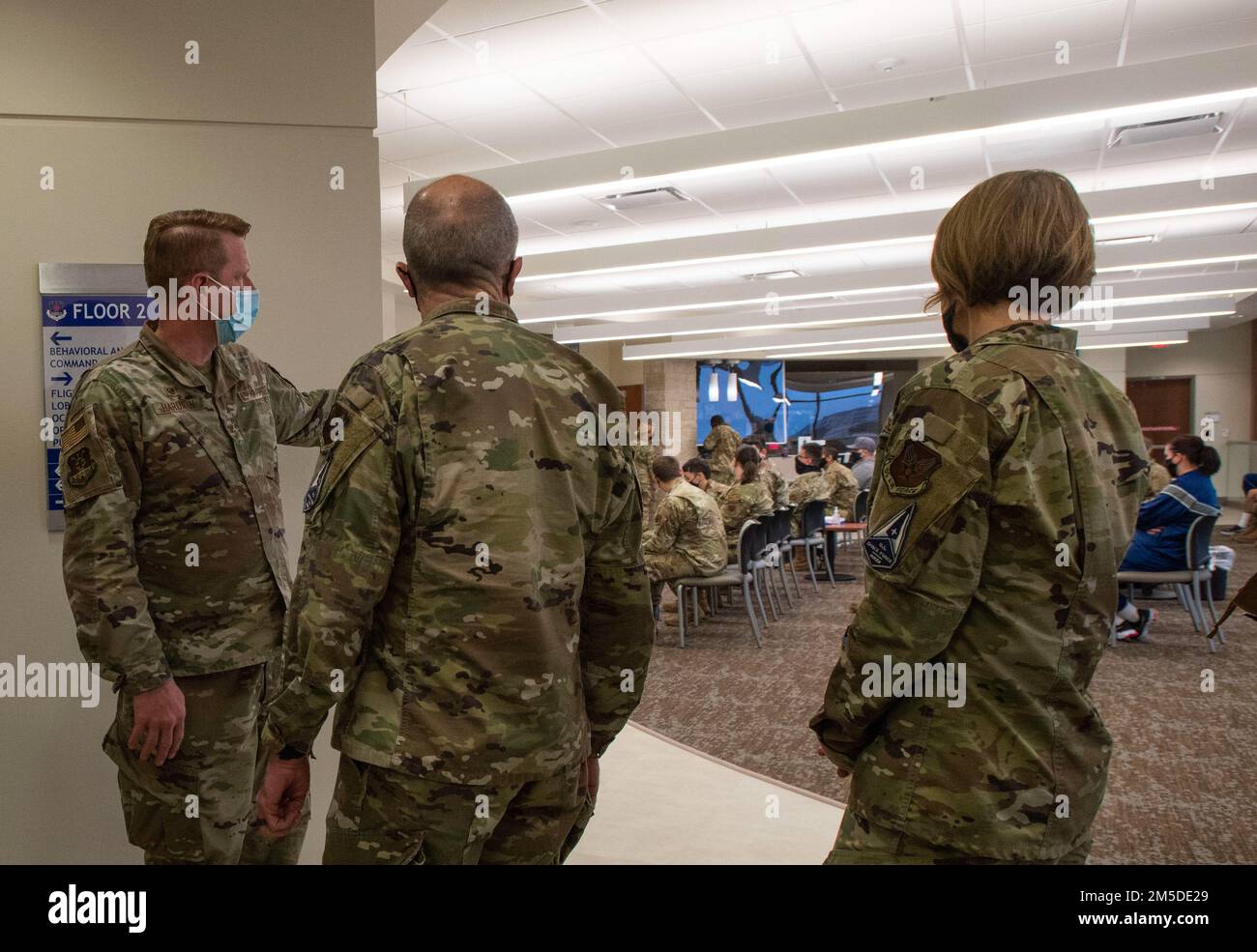 Col. Alan Hardman, 559th Medical Group commander, briefs Lt. Gen