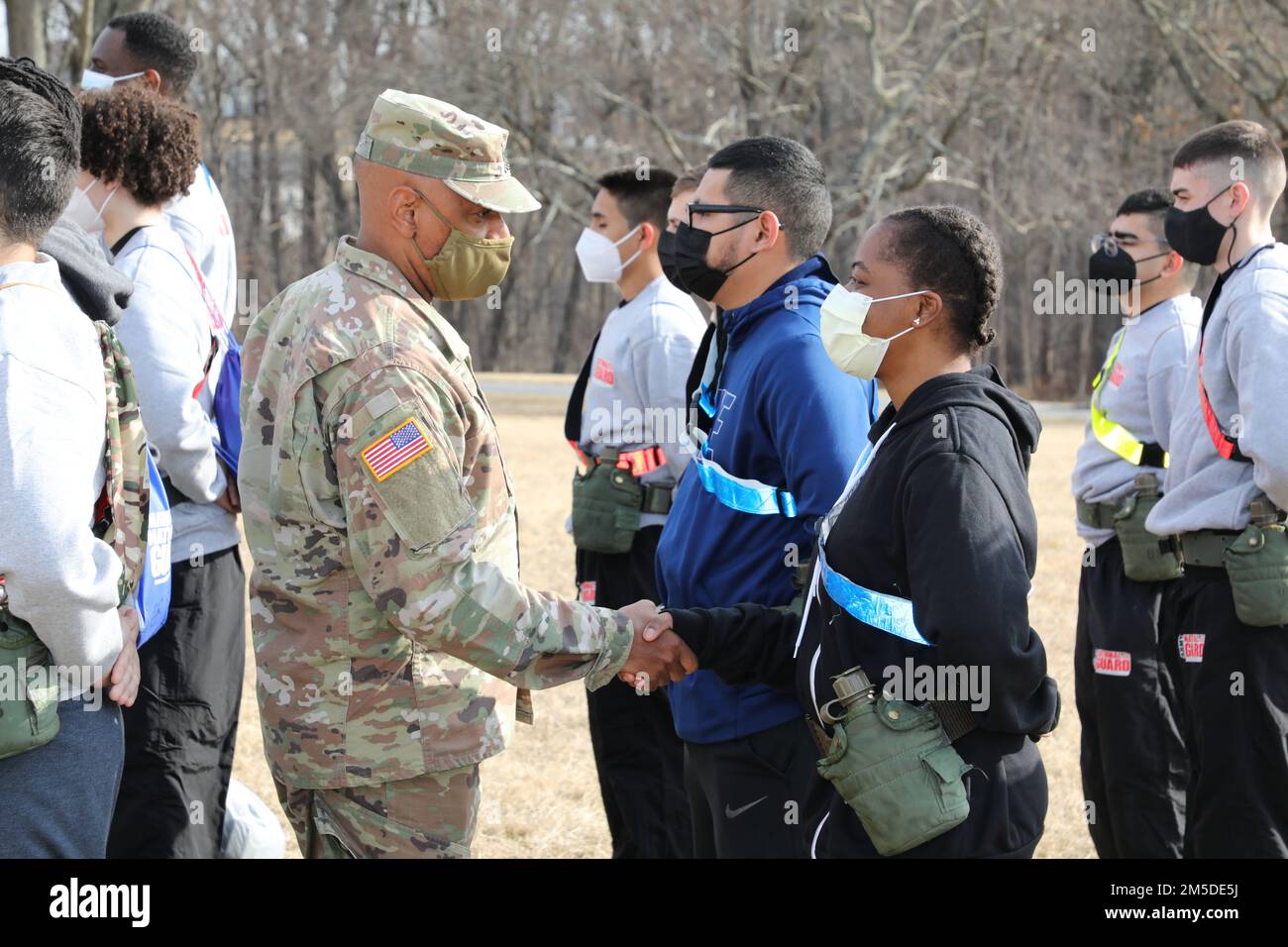 1st Sgt. Frederick Cox, first sergeant of the Maryland Army National Guard's Recruiting and Retention Battalion's C. Company, shakes the hand of a Recruit Sustainment Program soldier during drill weekend at Camp Fretterd Military Reservation in Reisterstown, Maryland, on March 5, 2022. The RSP drill weekends serve as an introduction to the military lifestyle that helps soldiers mentally, physically, and emotionally prepare for the rigors of Basic Combat Training. Stock Photo