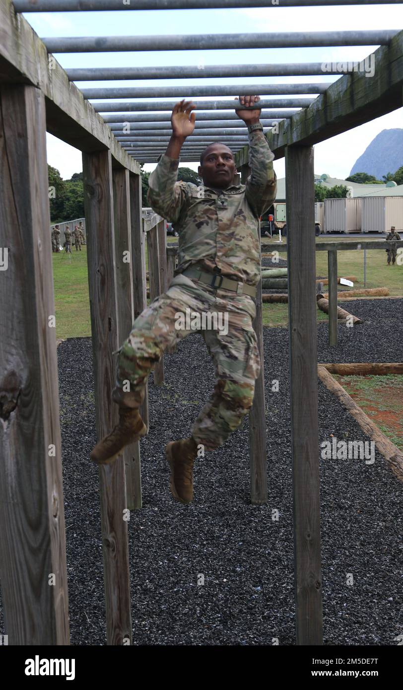 Hawaii Army National Guard (HIARNG) Soldier Spc. Kevin T. Brown, a mass communications specialist assigned to the 117th Mobile Public Affairs Detachment (MPAD),  103rd Troop Command, participates in the annual Best Warrior Competition (BWC) at the Regional Training Institute (RTI), Waimanalo, Hawaii, March 4, 2022. The BWC consists of a series of challenging events that tests the Soldiers and Non-Commissioned Officers (NCOs) in Army Combat Fitness Test (ACFT), land navigation, obstacle course, weapon marksmanship, ruck march, Warrior Tasks and Drills and a mystery event. Stock Photo