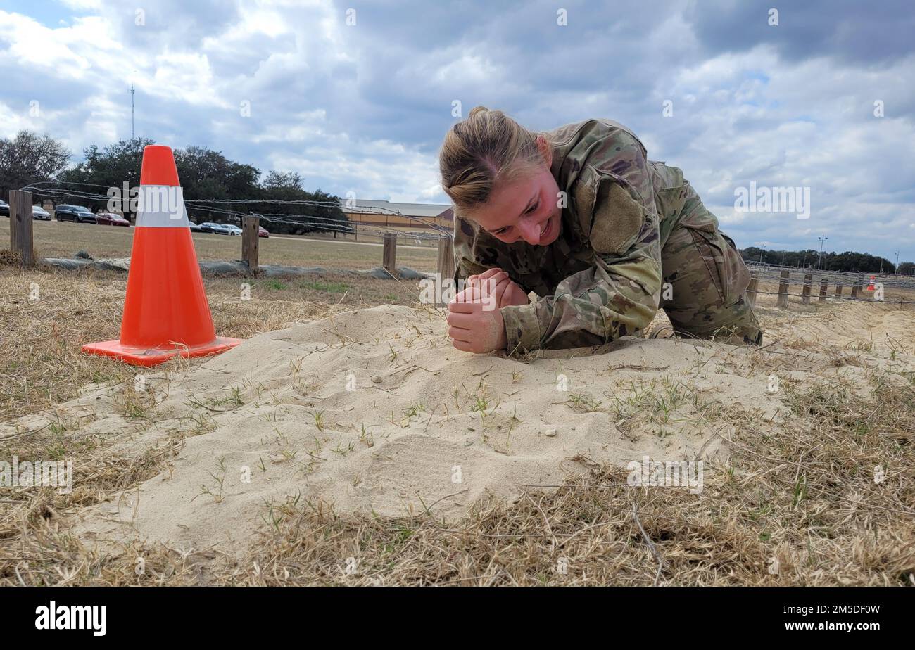 Spc. Hallie Koches, a vocalist with the 99th Readiness Division’s 78th Army Band, competes in the FY22 Consortium Best Warrior Competition March 3-6 at Camp Bullis on Joint Base San Antonio, Texas. The FY22 Consortium Best Warrior Competition kicked off with a 12-mile road march and is challenging Soldiers with tasks such as qualification with various weapons, the Army Combat Fitness Test, water survival, obstacle course, land navigation and urban warfare. The CBWC is a joint event featuring Soldiers belonging to several Army Reserve Commands from across the nation, to include the 80th Trainin Stock Photo