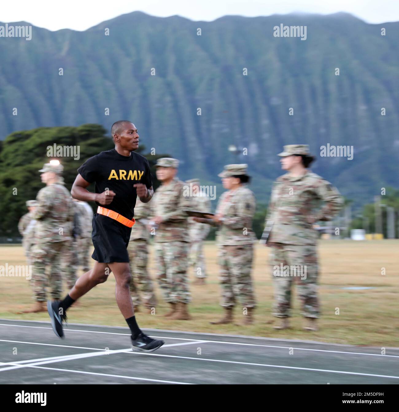Hawaii Army National Guard (HIARNG) Soldier Spc. Kevin T. Brown, a mass communications specialist assigned to the 117th Mobile Public Affairs Detachment (MPAD), crosses the finish line during the annual Best Warrior Competition (BWC) Army Combat Fitness Test (ACFT) event at the Regional Training Institute (RTI), Waimanalo, Hawaii, March 4, 2022. The BWC is an annual three-day event that Soldiers and Non-Commissioned Officers (NCOs) of the HIARNG and Hawaii Army Reserve compete in to earn the title of 'Best Warrior'. The BWC tests Soldiers' individual ability to adapt and overcome challenging s Stock Photo
