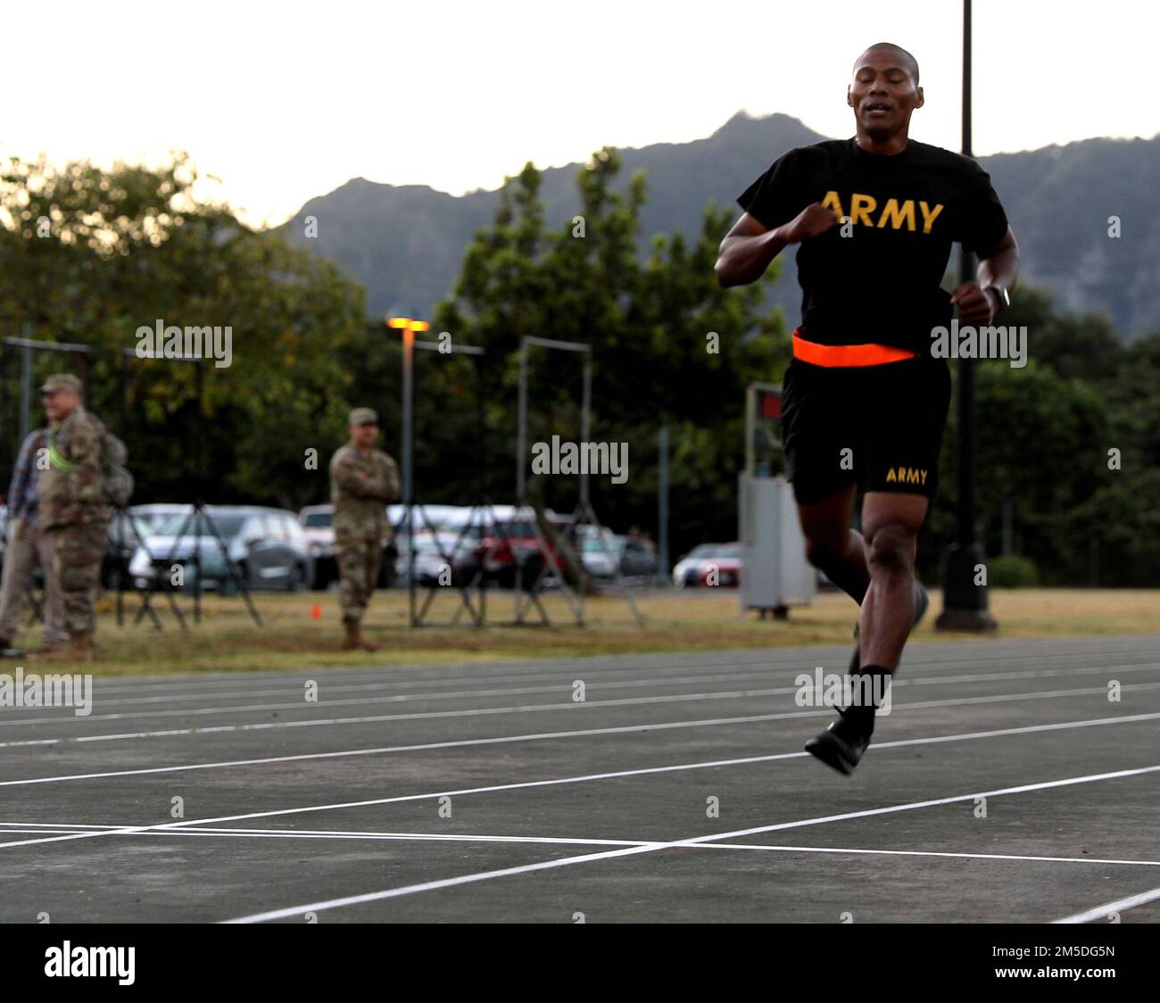 Hawaii Army National Guard (HIARNG) Soldier, Spc. Kevin T. Brown, a mass communication specialist with the 117th Mobile Public Affairs Detachment (MPAD), 103rd Troop Command, crosses the finish line during the annual Best Warrior Competition (BWC) Army Combat Fitness Test (ACFT) event at the Regional Training Institute (RTI), Waimanalo, Hawaii, March 4, 2022. Each event is designed to challenge Soldiers physically, mentally and emotionally. Stock Photo