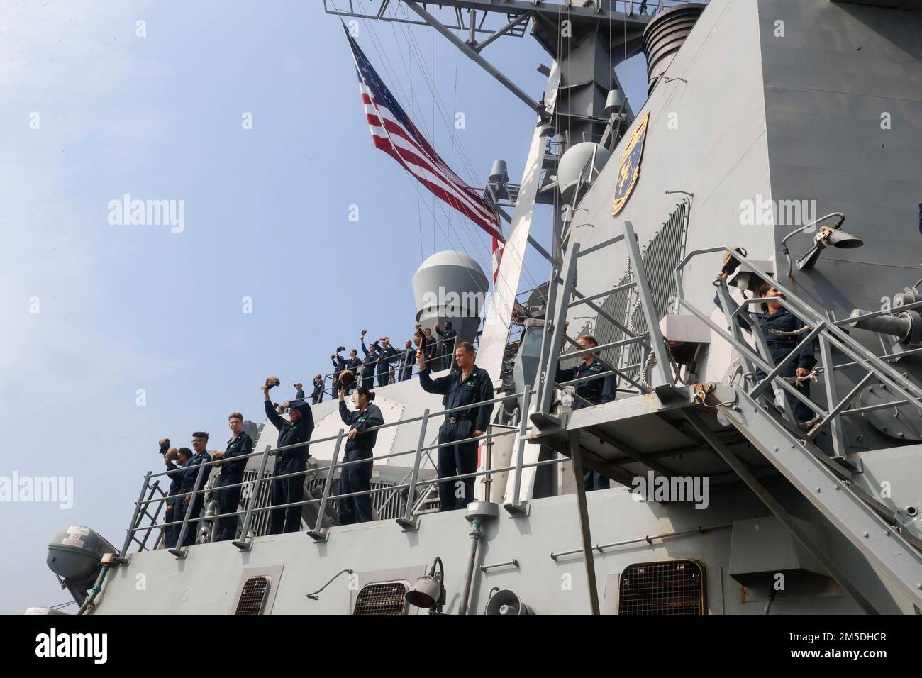 Ins Ranvir D54 INDIAN OCEAN (March 3, 2022) Sailors wave at the Rajput destroyer INS ...