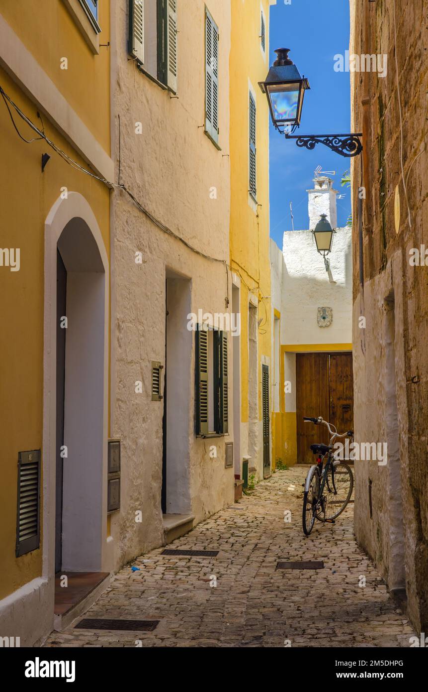 A bicycle in a narrow cobbled street in the ancient capitaly of Ciutadella, Menorca, Spain Stock Photo