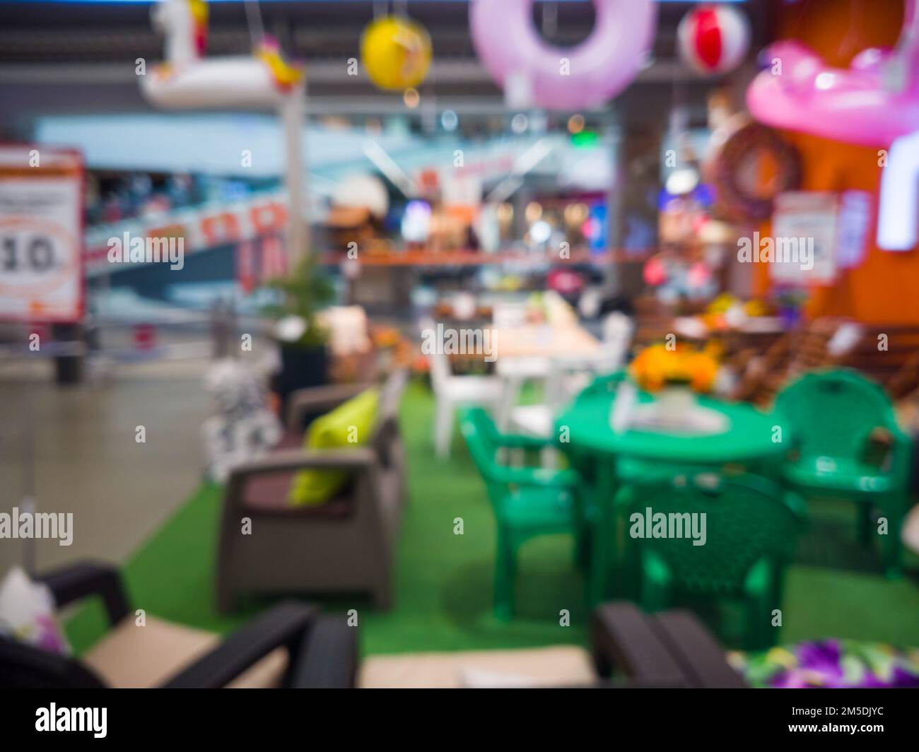 Abstract defocused blurred image of furniture store on sale. Department for the sale of garden furniture and tools - can use to display or montage on Stock Photo