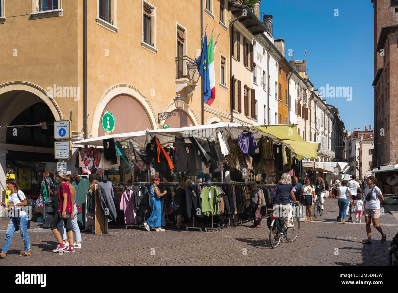 Market Italy, view in summer of the busy morning market sited in the Piazza delle Erbe in the scenic Renaissance era city of Mantua (Mantova), Italy Stock Photo