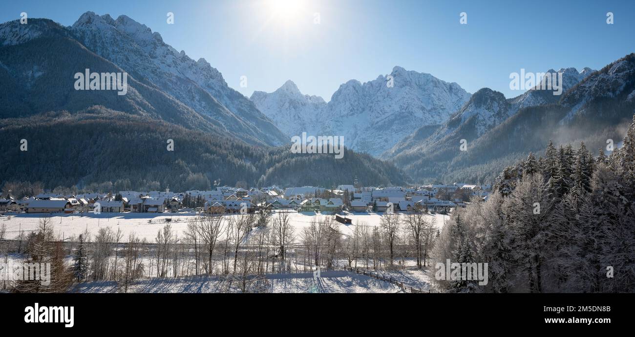 Kranjska Gora in Slovenia covered in snow at winter with Julian Alps and Triglav National Park in the background Stock Photo