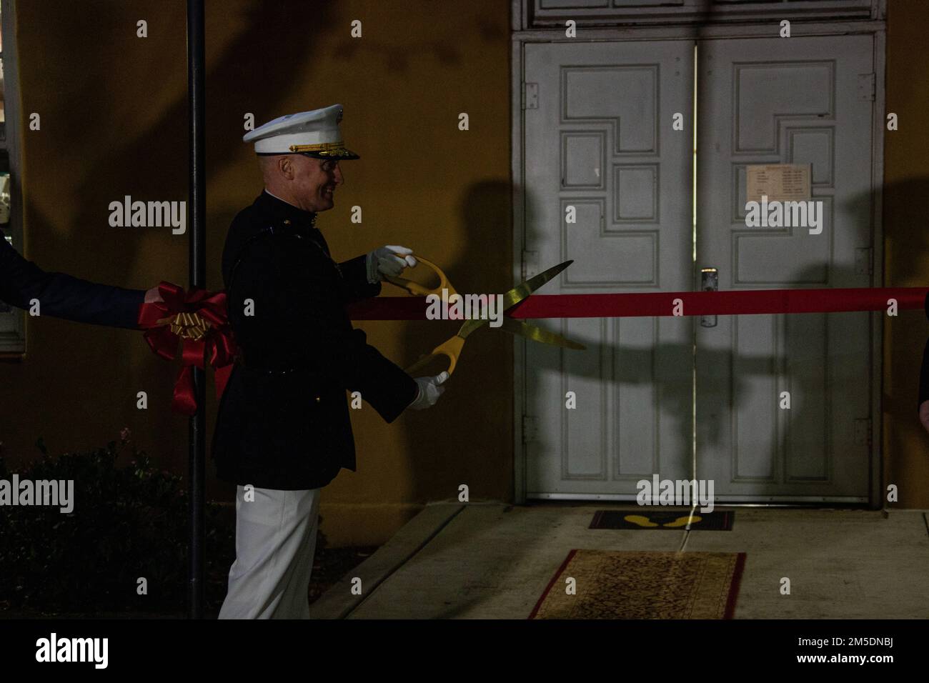 U.S. Marine Corps Brig. Gen. Jason L. Morris cuts the ribbon at the ...