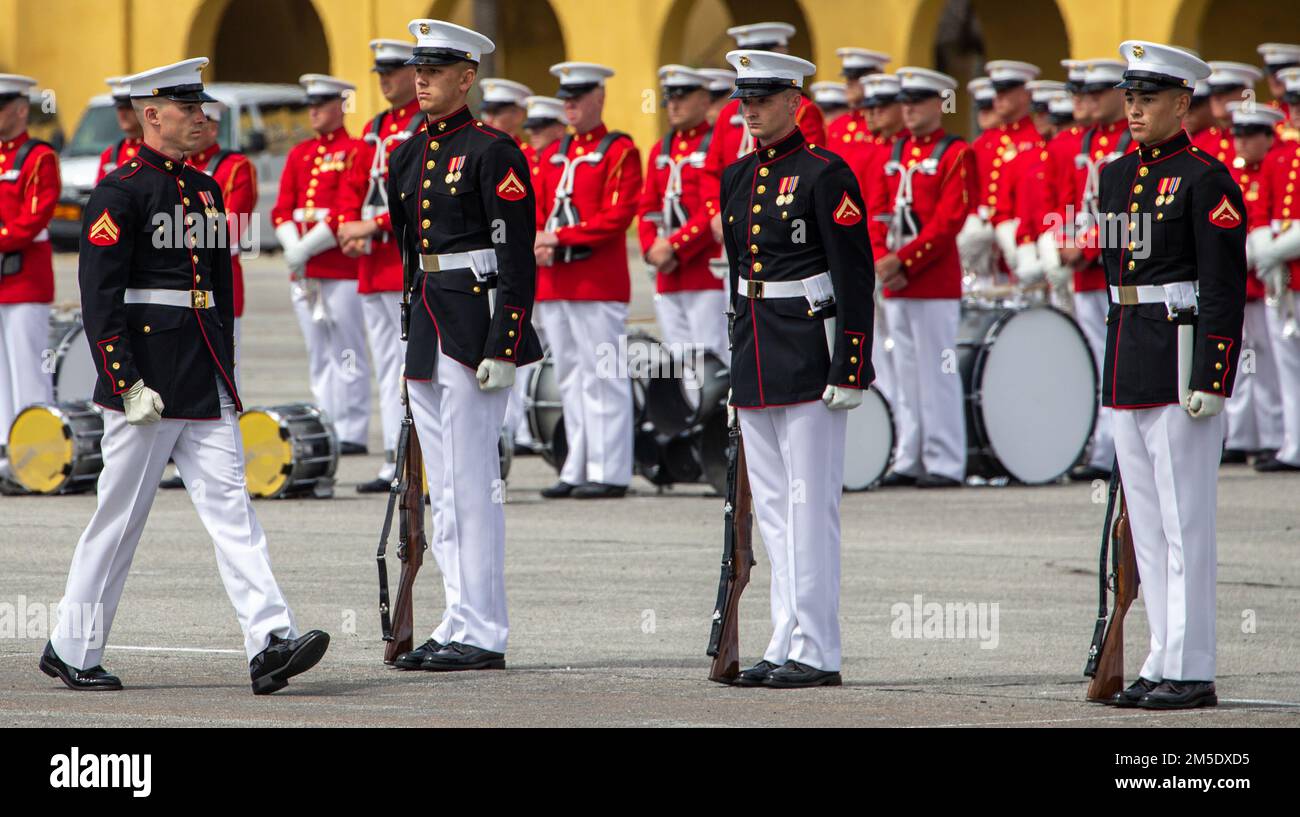 Corporal Blake Behrens, number two rifle inspector, Silent Drill Platoon, inspects the platoon during a Battle Color Ceremony at Marine Corps Recruit Depot San Diego, March 5, 2022. MCRD San Diego memorialized the 100 year anniversary of its commissioning by hosting a Battle Color Ceremony. Stock Photo