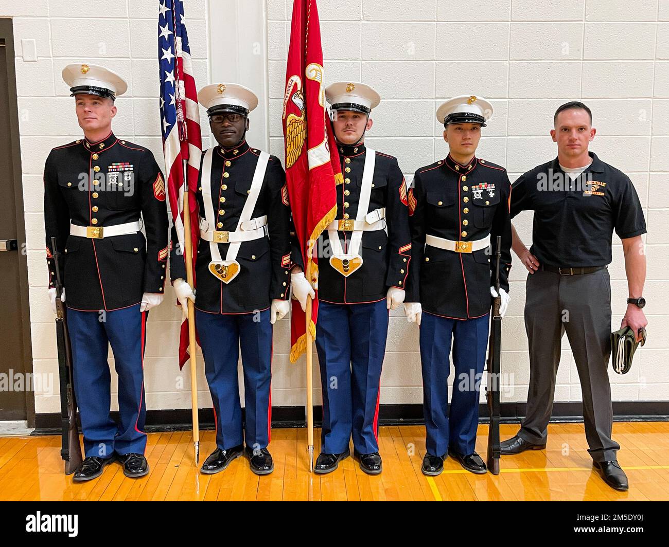 1st Battalion 24th Marines Weapon Company's color guard gets ready to present the Marine Corps flag at the final ceremony at Adrian College in Adrian, Michigan on March 05, 2022. The United States Marine Corps and the NCAA partnered up to host the National Collegiate Women’s Wrestling Championships in order to build good relations with Colleges and pave way for young potential future United States Marine Corps Officers. (United States Marine Corps photo by Cpl. Cheng Chang) Stock Photo