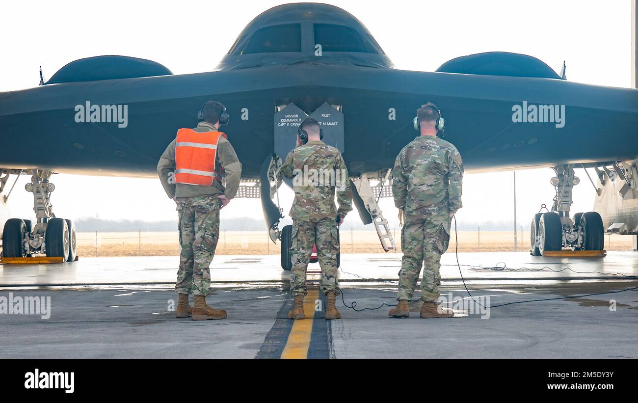 From left, Senior Airman Evan Goade, Staff Sgt. Samuel Baer, and Senior Airman Kyle Wilson, 131st Aircraft Maintenance Squadron crew chiefs, prepare to launch a B-2 Spirit stealth bomber March 6, 2022, at Whiteman Air Force Base, Missouri. Air National Guard crew chiefs like these are critical ensuring the B-2 mission can reliably deliver global strike capability any time, anywhere. Stock Photo