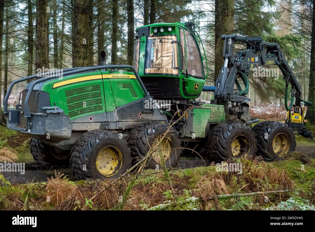 An eight-wheeled logging machine parked for the Christmas break in Beacon Wood, Penrith, Cumbria, UK Stock Photo