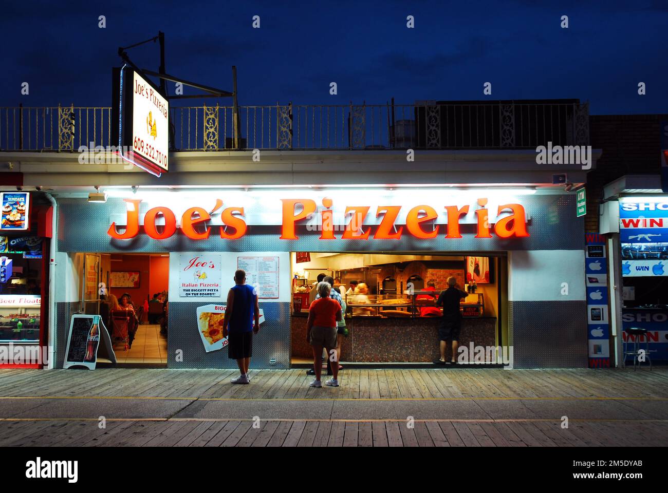 Joe’s Pizzeria feeds hungry people late at night on the boardwalk in Wildwood, on the Jersey Shore Stock Photo