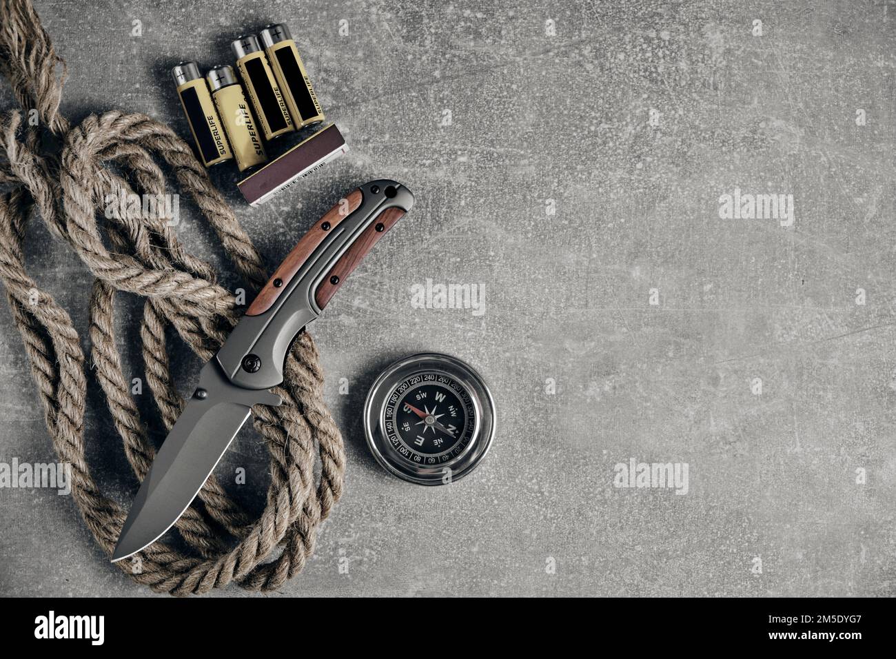 Tactical folding knife for survival, rope, matches,batteries and