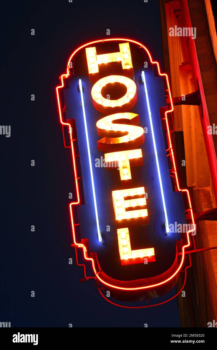 A neon sign advertises for a hostel in Venice Beach, near Los Angeles, at night Stock Photo