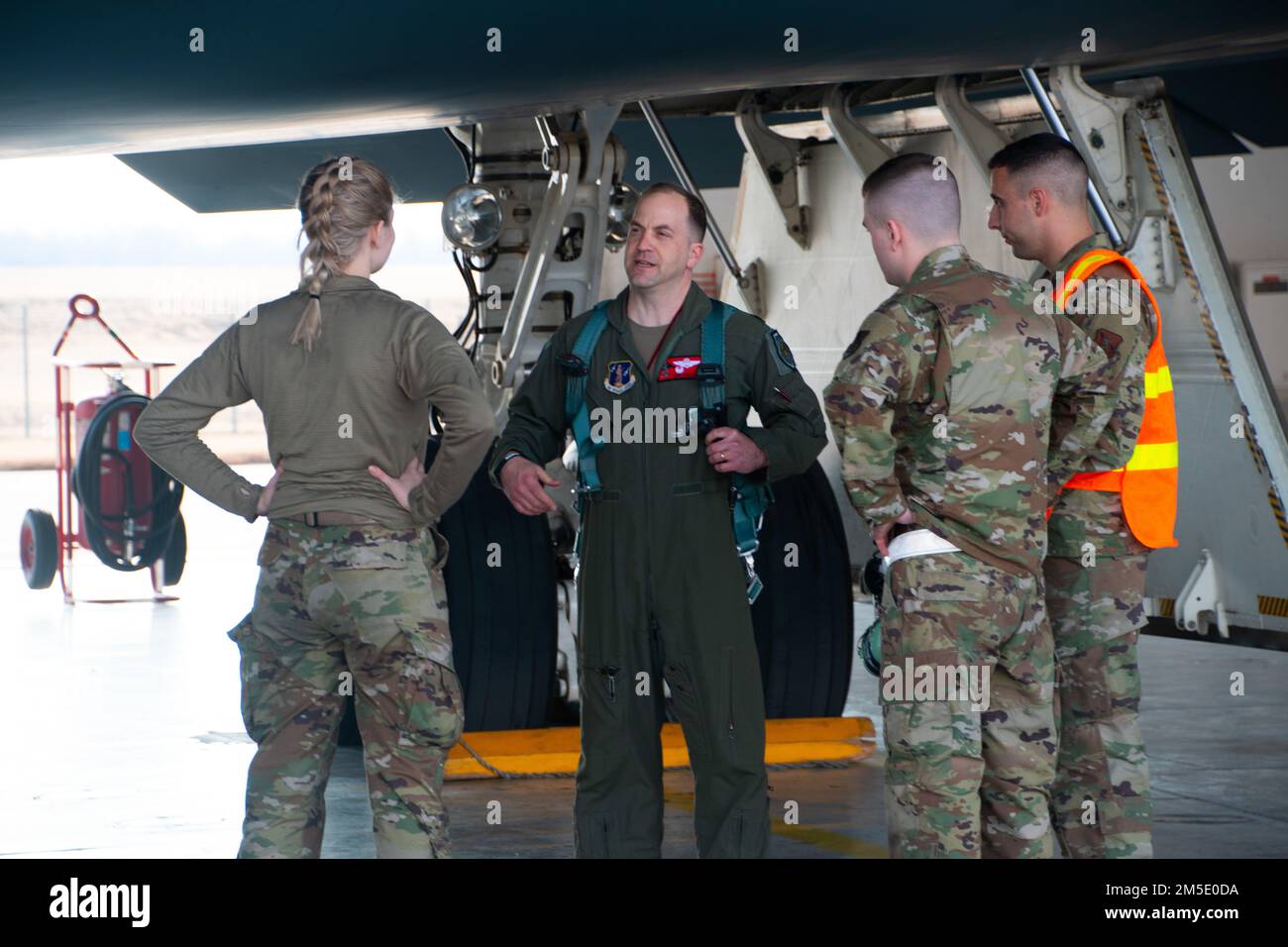 Lt. Col. Timothy Sullivan, 131st Bomb Wing pilot, talks with his crew chiefs in front of the B-2 Spirit stealth bomber March 5, 2022, at Whiteman Air Force Base, Missouri. Sullivan flew his final B-2 flight in which he also surpassed 1500 hours in the B-2. Stock Photo