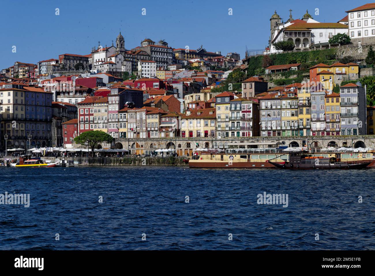 View of the old town of Porto across the river Douro from the Gaia side, Portugal, deep blue river water Stock Photo