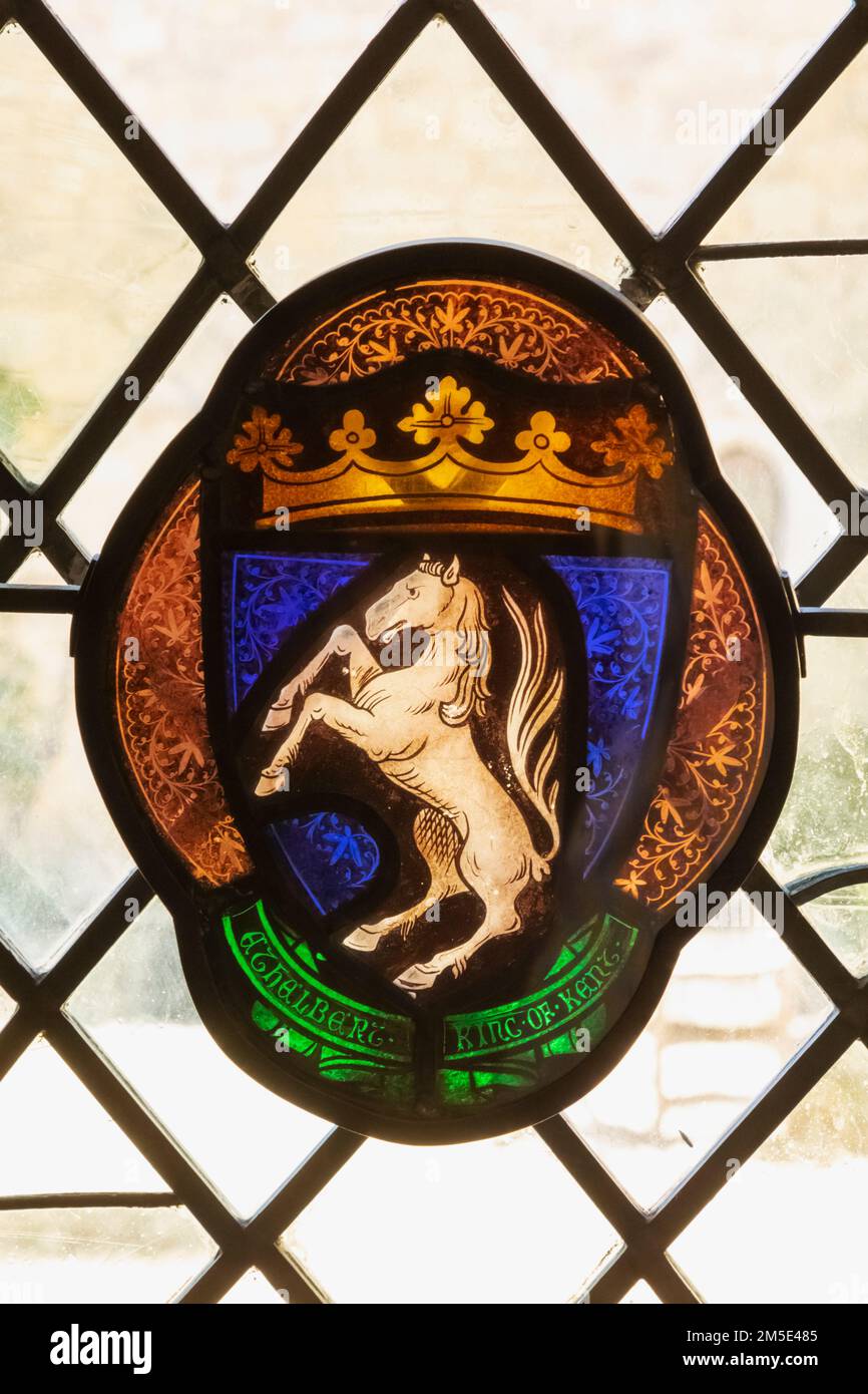 England, Kent, Sevenoaks, Ightham Mote, 14th century Moated Manor House, Stained Glass Window depicting The Coat of Arms of Ethelberht King of Kent Stock Photo