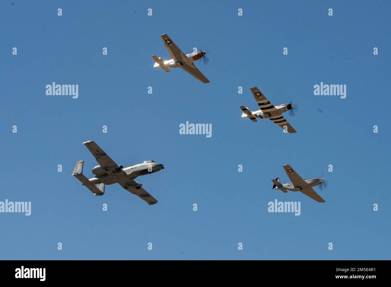 U.S. Air Force Maj. Haden 'Gator' Fullum, A-10 Thunderbolt II Demonstration Team pilot and commander, flies in a four-ship formation alongside 3 P-51 Mustangs during Heritage Flight Training Course at Davis-Monthan Air Force Base, Arizona, March 6, 2022. During the event, civilian warbird pilots and current Air Force demonstration pilots trained together ahead of the 2022 air show season. Stock Photo