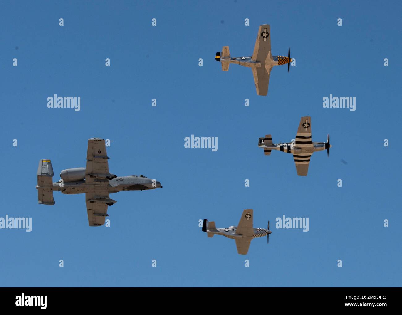 U.S. Air Force Maj. Haden 'Gator' Fullum, A-10 Thunderbolt II Demonstration Team pilot and commander, flies in a four-ship formation alongside 3 P-51 Mustangs during Heritage Flight Training Course at Davis-Monthan Air Force Base, Arizona, March 6, 2022. During the event, civilian warbird pilots and current Air Force demonstration pilots trained together ahead of the 2022 air show season. Stock Photo