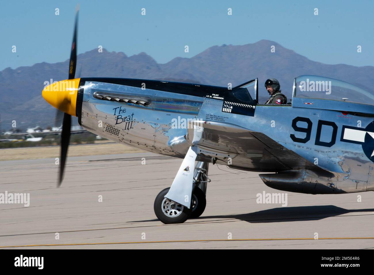 A P-51 Mustang taxies on the flightline in preparation for taking part in the Heritage Flight Training Course at Davis-Monthan Air Force Base, Arizona, March 6, 2022. This annual event provides the opportunity for civilian warbird pilots and current Air Force demonstration pilots to train together to prepare for the 2022 air show season. Stock Photo