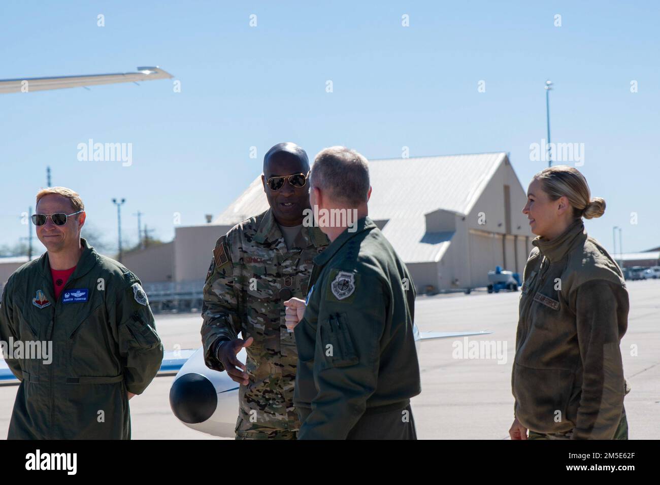 U.S. Air Force Gen. Mark Kelly, commander of Air Combat Command, greets the 355th Wing Commander Col. Joseph Turnham (left) and the 355th Wing’s Command Chief Master Sgt. Dana Council, during Heritage Flight Training Course at Davis-Monthan Air Force Base, Arizona, March 6, 2022. Kelly visited the newly designated Lead Wing and certified ACC’s Heritage Flight Training Course hosted at Davis-Monthan Air Force Base, Arizona, from March 2-6. Stock Photo