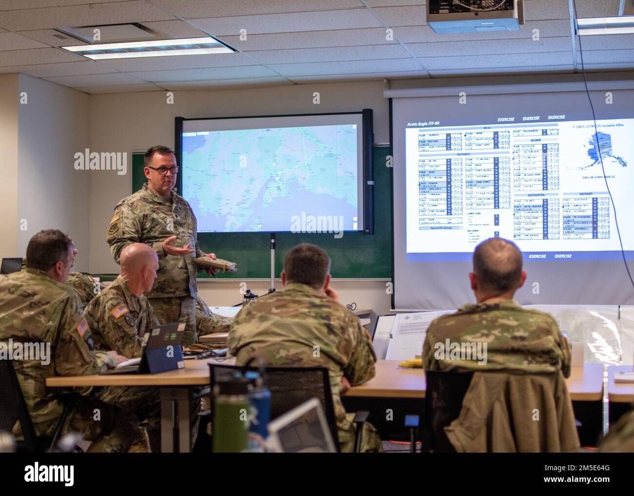 U.S. Air Force Lt. Col. Robert Andrews, with the 145th Air Wing, North Carolina National Guard, briefs air operations during Arctic Eagle-Patriot 2022 (AEP22) at the Alaska National Guard Joint Force Headquarters on Joint Base Elmendorf-Richardson, March 5, 2022. Exercise AEP22 increases the National Guard’s capacity to operate in austere, extreme cold-weather environments across Alaska and the Arctic region. AEP22 enhances the ability of military and civilian interagency partners to respond to a variety of emergency and homeland security missions across Alaska and the Arctic. Stock Photo