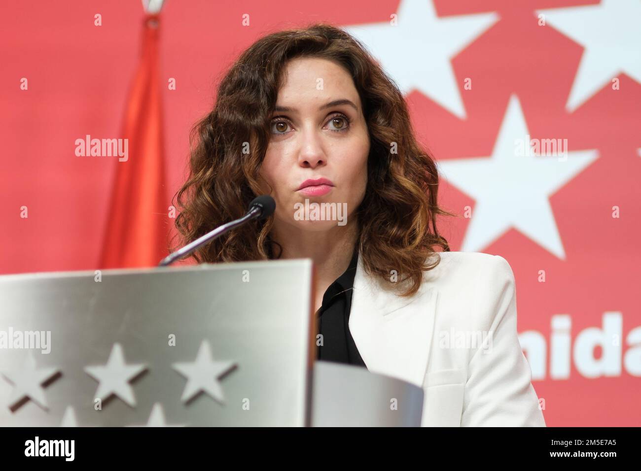 The president of the Community of Madrid, Isabel Diaz Ayuso, speaks during a press conference after the meeting of the Governing Council of the Community of Madrid, at the Real Casa de Correos in Madrid. Ayuso takes stock of the year and defends that her Government 'complies' with the people of Madrid and has managed 'well' against the 'authoritarianism of the Government that has not hesitated to punish the region' and that launches measures of 'engañabobos'. She defended that her good management is proven 'in the vitality of the streets of Madrid, in its cultural, business and tourist life'. Stock Photo