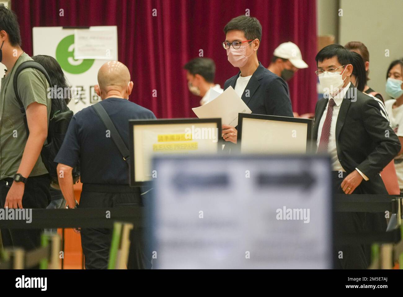 Legislator Johnny Ng Kitchong (centre) queues for COVID19 PCR Tests