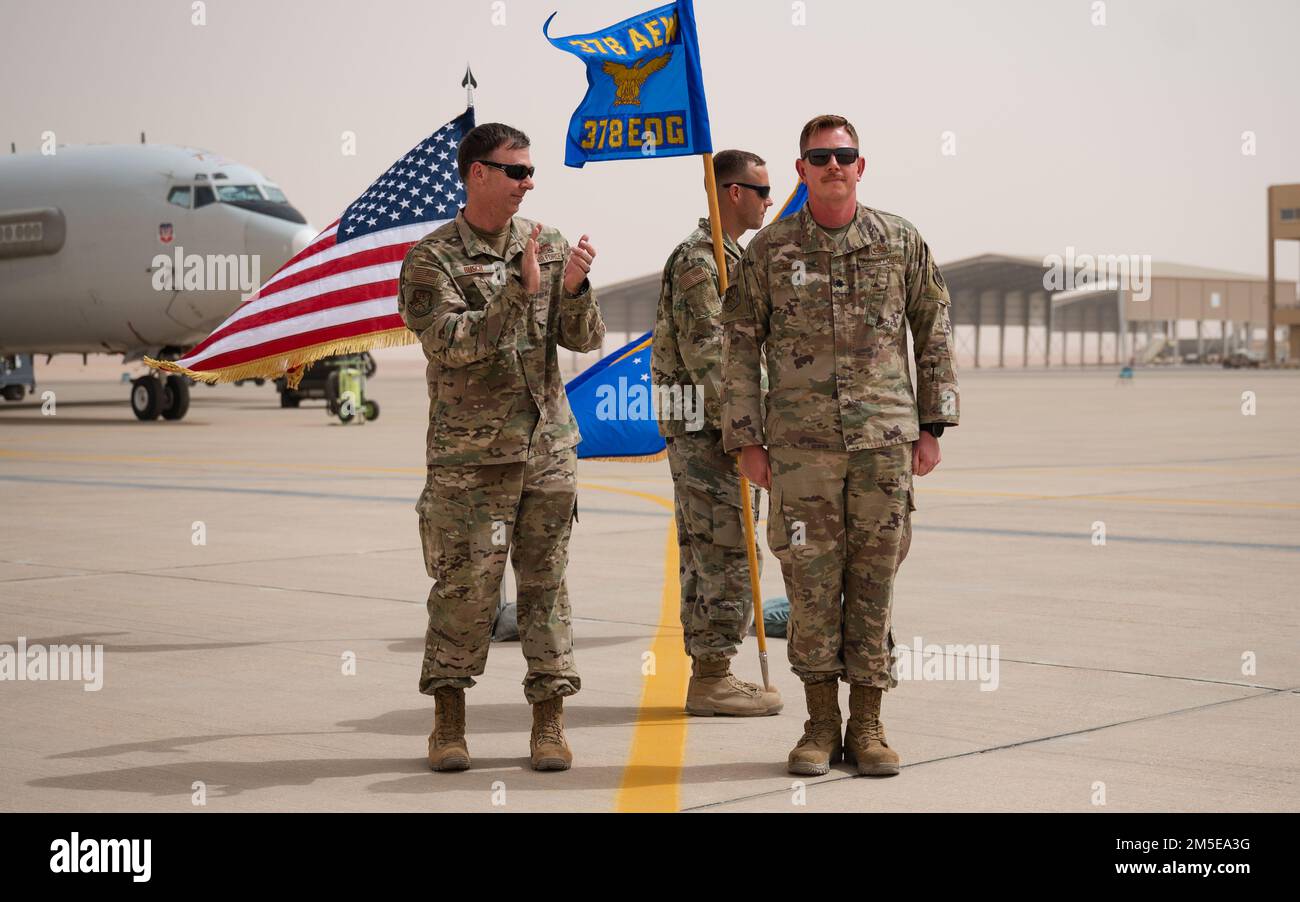 U.S. Air Force Col. Benjamin Busch, 378th Expeditionary Operations Group commander, congratulates U.S. Air Force Lt. Col. Jason Purcell, incoming 378th Expeditionary Aircraft Maintenance Squadron commander, during the 378th AMXS unit activation ceremony at Prince Sultan Air Base, Kingdom of Saudi Arabia, March 7, 2022. The 378th EAMXS is tasked with maintaining the combat readiness of PSAB’s KC-10 Extenders and E-3 Sentries. Stock Photo