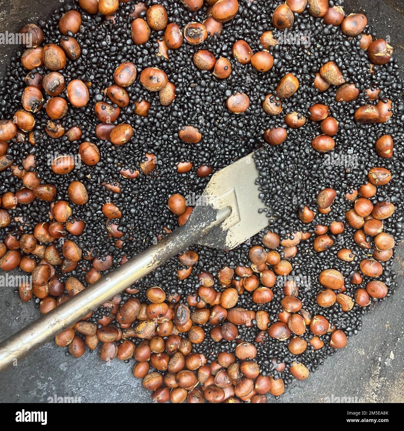 Chestnuts being roasted, by Kobus Tsang and his mother Chi Lee Tsang who work out of a cart in Hong Kong's Causeway Bay district, December 09, 2022. Unlike other nuts and seeds, chestnuts are relatively low in calories and fats but rich in vitamins and minerals. 09DEC22  SCMP / Kylie Knott Stock Photo