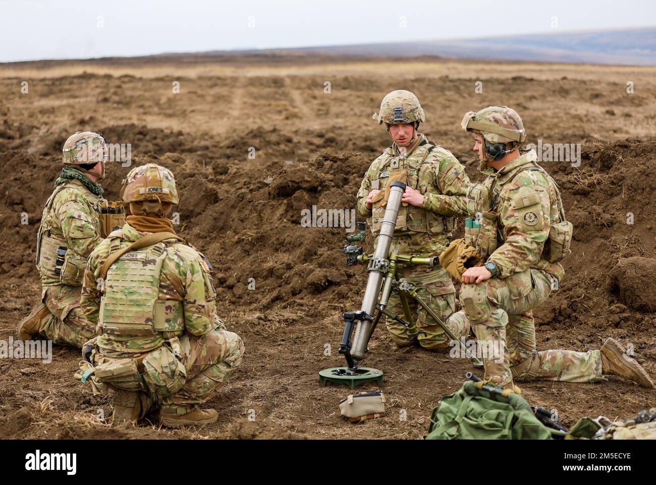 U.S. Army Soldiers, assigned to “Ghost Troop” Second Squadron, 2nd Cavalry Regiment, set up a 60-mm mortar during a combined arms live fire training exercise at Smardan Training Area on March 7, 2022. The CALFEX strengthens bonds of friendship between U.S. and Romanian forces and helps deter further aggression in Europe. Stock Photo